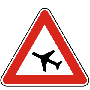 Značka A 31 - Lietadlá - upozorňuje na miesto, kde nad cestou v malej výške preletúvajú lietadlá.